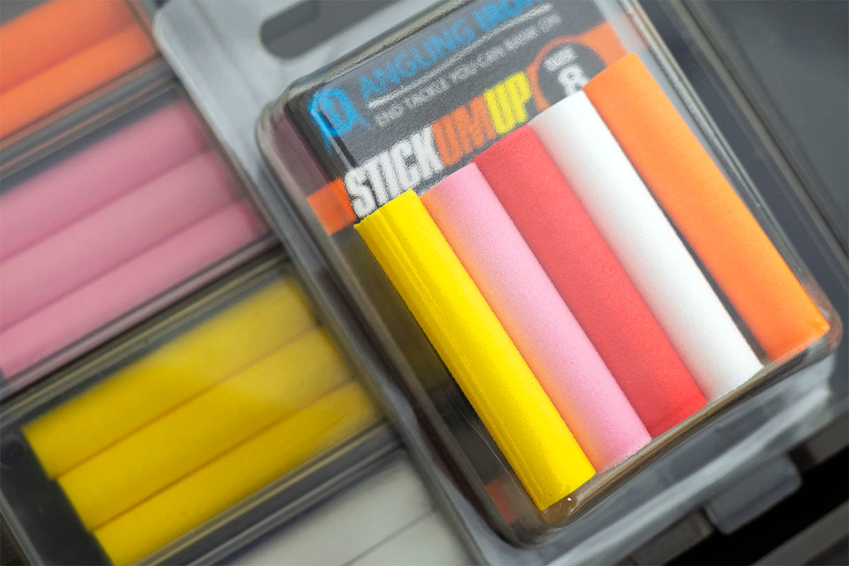 A mixed pack of Angling 8mm Zig foam sticks, on top of a well stocked tackle box. A Choice of eight colour foams helps you create the right colour combinations for the Carp fishing conditions on the day.