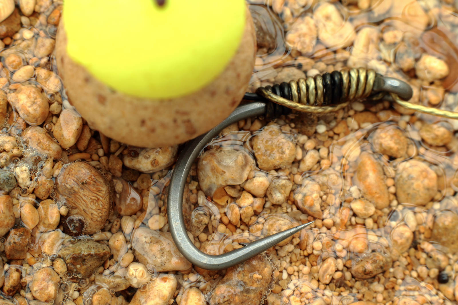 Size 4 Duropoint Anchor Carp hook as part of a snowman rig, Boilie tipped with half a yellow popup over Gravel