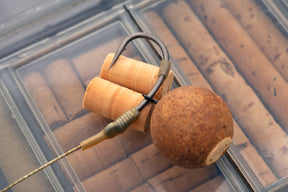 A Bottom bait has been plugged with a piece of 6mm Cork to create a wafter which is attached to the super effective German Rig tied using a Size 5 Curve Shank hook, Silicone, Trans Khaki Shrink tubing and a Size 12 mini Rig swivel. 