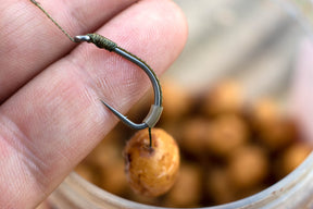 A Claw rig, with Tigernut hookbait tied with supple braid, silicone tubing and a Duropoint Anchor hook . A Classic big carp Rig.