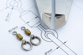 A photo of our own design Essentials Size 11 Flexi Ring or Chod swivels before manufacture. Clearly visible is the Stainless Steel and Brass construction specified to create a strong and Functional piece of end tackle.